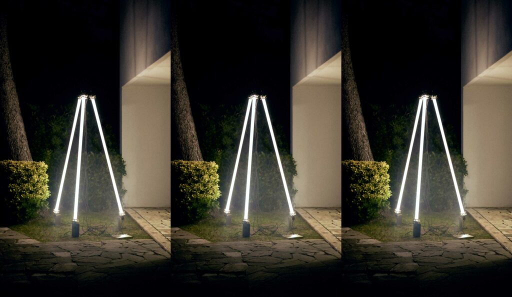 Large tripod light fixture: Three tubes converge, creating a statement piece in Nicolo Taliani's signature style.