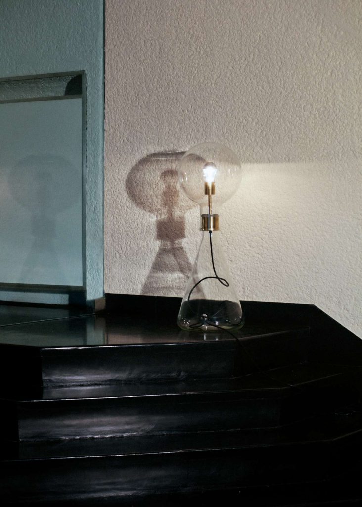 Glass & brass tall lamp: Nicolo Taliani's elegant illumination masterpiece for sophisticated spaces.